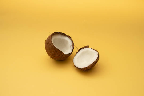 istock Halfs of coconut in minimal style. 1299309203