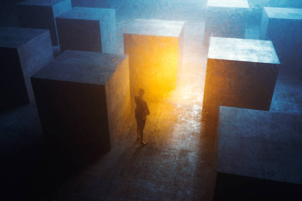 istock Abstract businesswoman in dark maze 1299309378