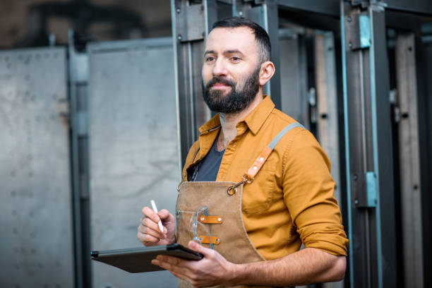 istock Worker with a digital tablet at the plant 1299311562
