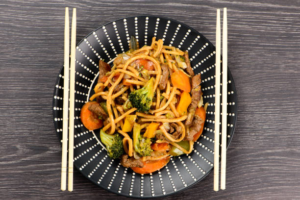 istock Yaksoba on a black plate on a table 1299313522