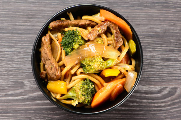 istock bowl with yakisoba on dark table 1299313632