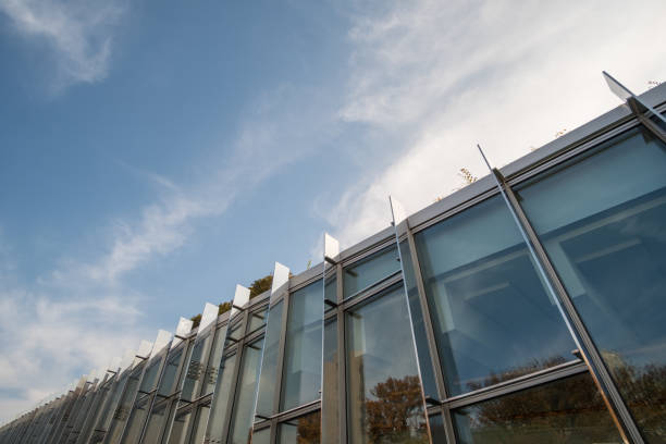 istock Modern glass facade office building against blue sky 1299315092