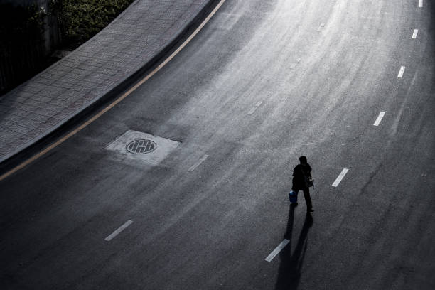 istock road and shadow with traffic in black and white color. 1299315468