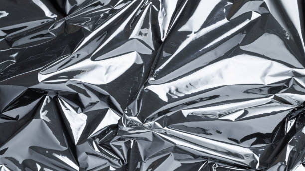 istock Smooth plastic texture. Black shiny film bag pattern. Wrap transparent dark cellophane background for packaging, product protection. 1299315493