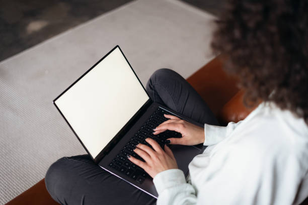 istock Young adult woman using modern laptop computer 1299316169