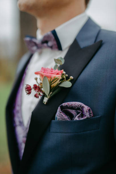 istock Groom wearing a boutonniere at his wedding 1299317320