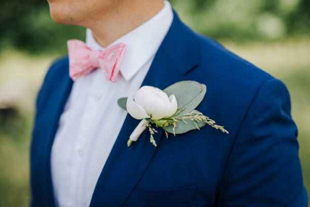istock Groom wearing a boutonniere at his wedding 1299317454
