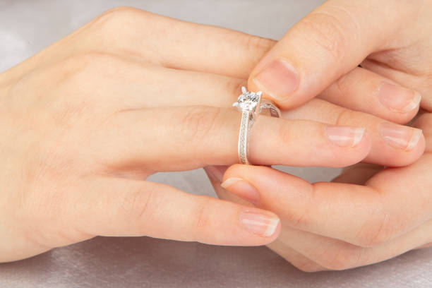 istock wearing a white gold ring 1299317788