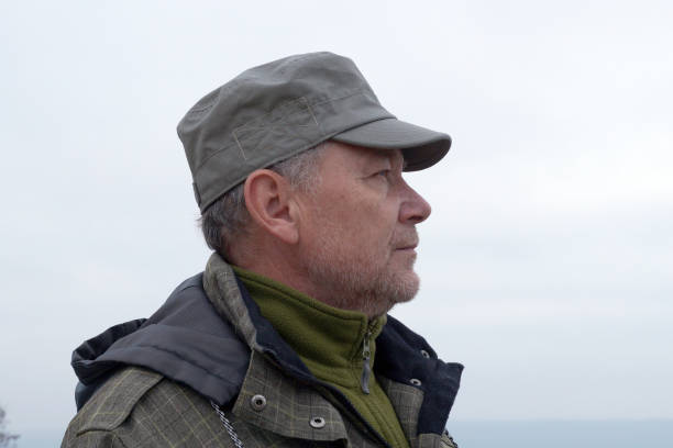 istock portrait of a middle aged man wearing a cap 1299317888