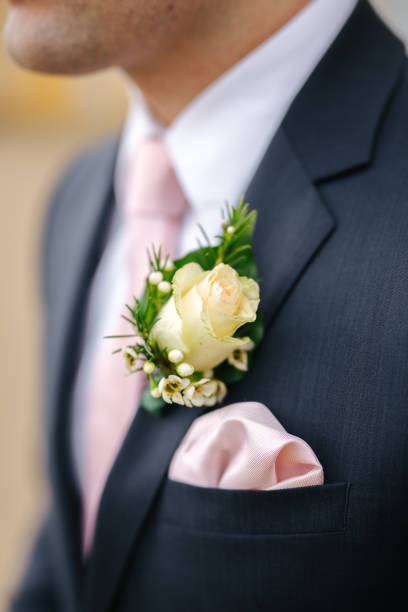istock Groom wearing a boutonniere at his wedding 1299318704