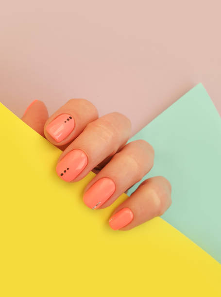 istock female hand beautiful manicure on a colored background 1299319896
