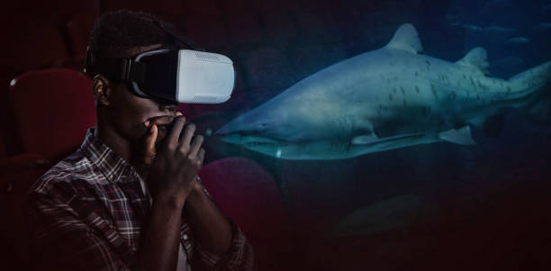 Composite image of man wearing virtual reality headset in theater