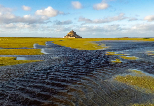 istock Mont Saint Michel surrounded by water 1299319983
