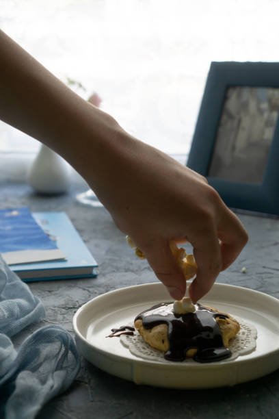 istock Making a delicious dessert with chocolate cream 1299322031