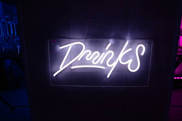 istock drinks. neon LED inscription on the bar. 1299322147