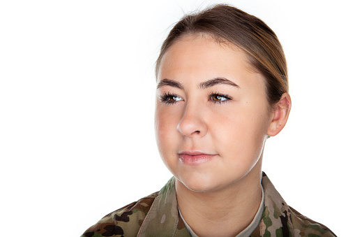 Close up of happy female soldier using a ring flash to give dramatic lighting.