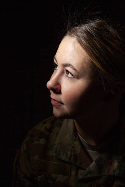 istock Dramatic Close Up of Female Soldier 1299322397