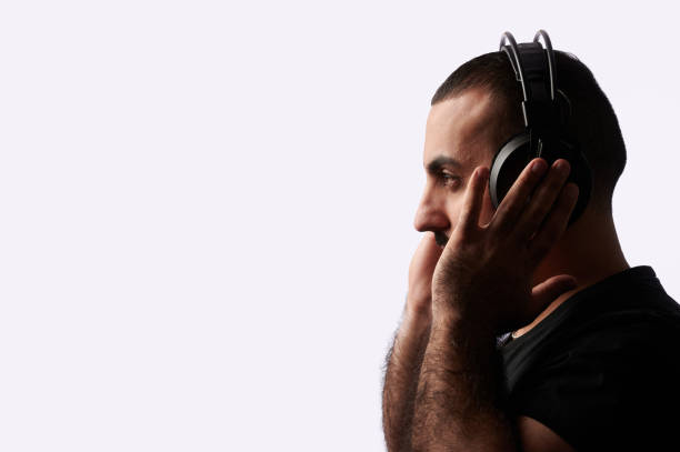 Young arabian man dj with headphones on isolated background