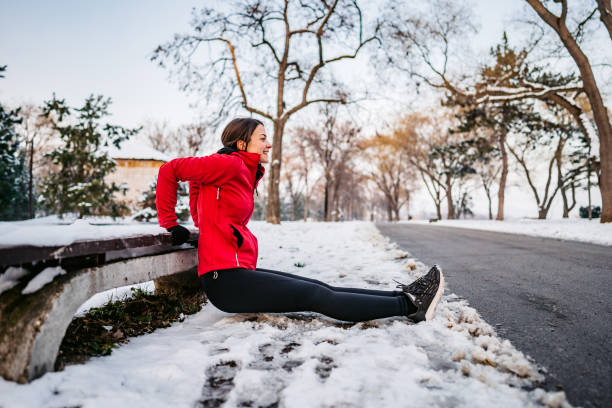 istock Woman doing triceps workout on bench in winter 1299323016