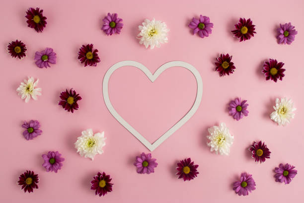 istock Background with flowers and heart shape copy space, Valentines or woman's day concept. Minimal flat lay nature. 1299323099