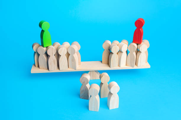 istock Two rival leaders attract people to their side on scales. Get the support of majority on elections. Political debate. Election campaign. Electorate. Position expression 1299323642