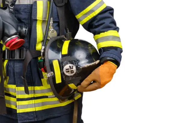 Photo of Hardhat in hand of unrecognized firefighter