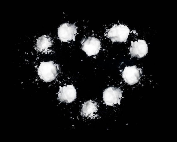 istock heart shape made of snowballs on black wall 1299329995