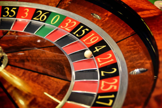 istock Casino gambling zone with cards and roulette 1299330076