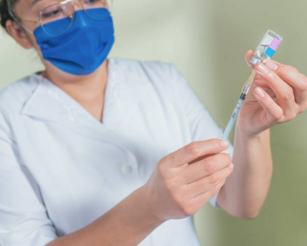 istock Preparation of a medical syringe for vaccination 1299332830