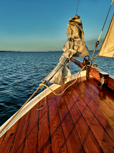 istock Yacht sailing at beautiful sunset. 1299333106