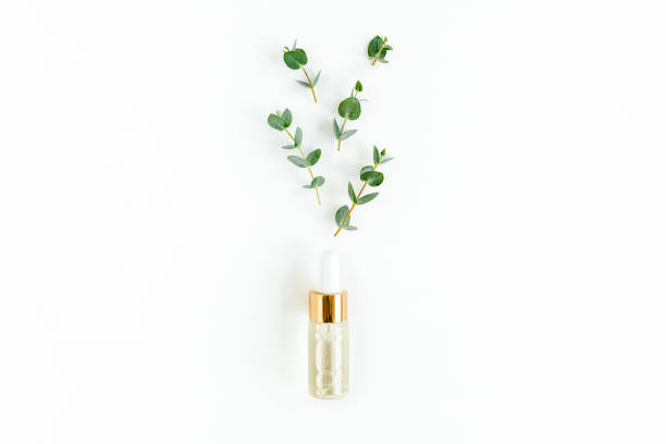 istock Eucalyptus essential oil, eucalyptus leaves on white background. Natural, Organic cosmetics products. Medicinal, Natural Serums. Flat lay, top view 1299333162