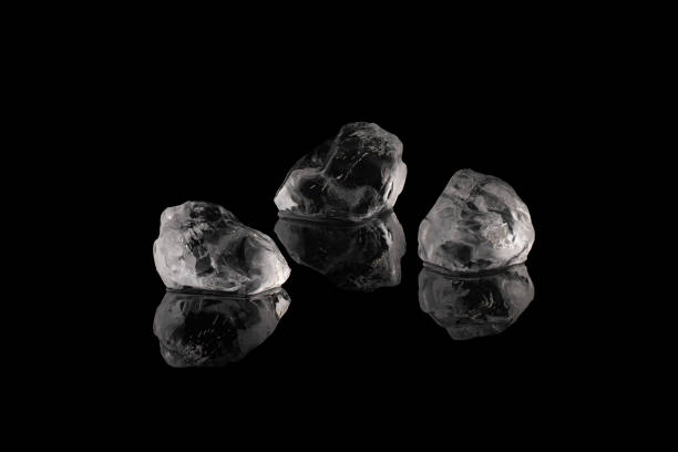 Three pieces of ice isolated on a black background.