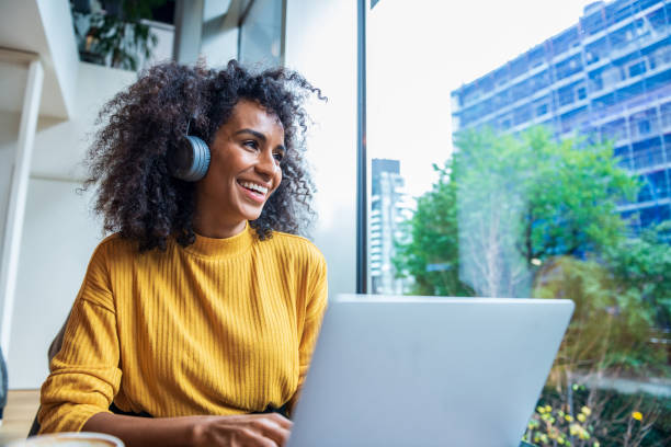 istock Business woman having a break at coffee shop 1299333989