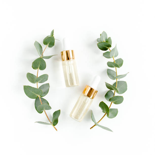 istock Eucalyptus essential oil, eucalyptus leaves on white background. Natural, Organic cosmetics products. Medicinal, Natural Serums. Flat lay, top view 1299334056