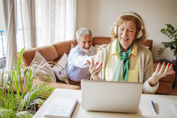 istock Senior woman is communicating on video call with family 1299334287