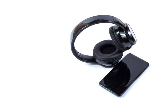 istock Cellphone and headphones isolated on a white 1299334543