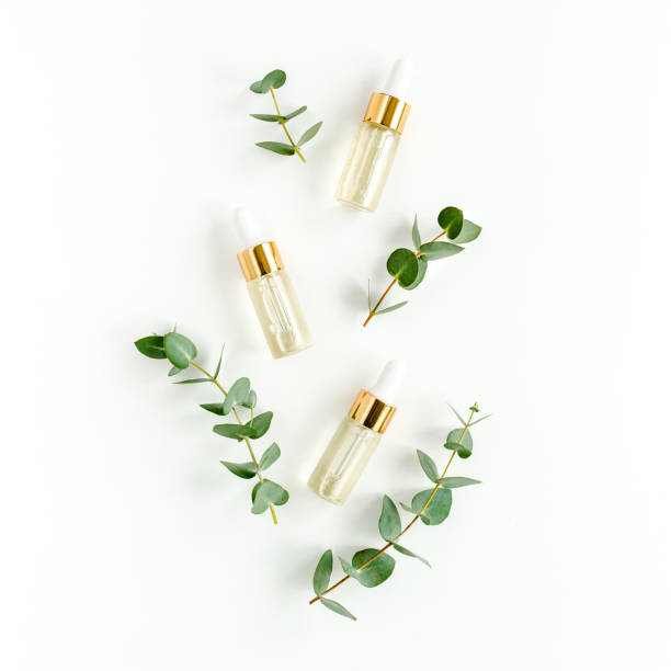 istock Eucalyptus essential oil, eucalyptus leaves on white background. Natural, Organic cosmetics products. Medicinal, Natural Serums. Flat lay, top view 1299335253