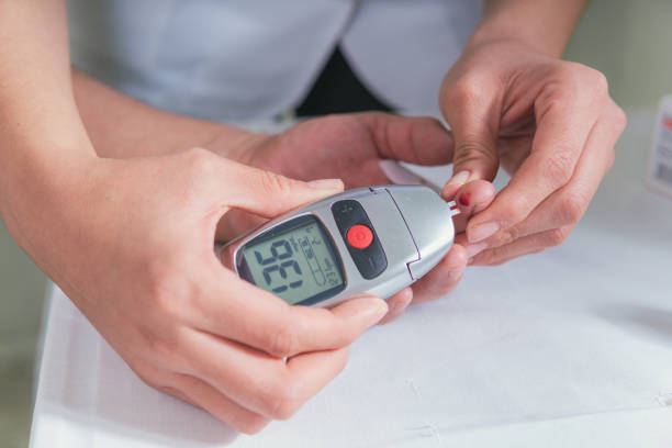 istock Taking blood to measure glucose 1299337662