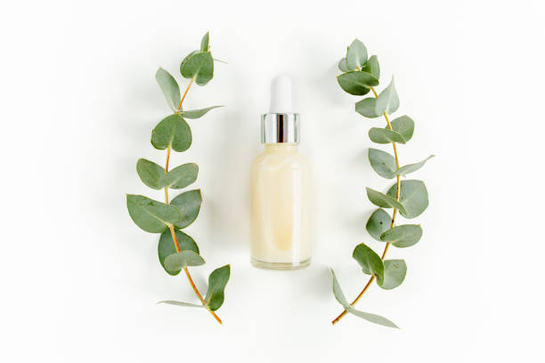istock Eucalyptus essential oil, eucalyptus leaves on white background. Natural, Organic cosmetics products. Medicinal, Natural Serums. Flat lay, top view 1299338124