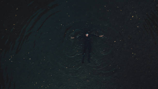 istock Triathlete swimming in the river 1299339146