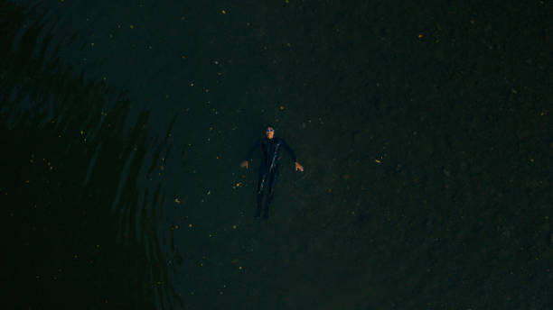 istock Triathlete swimming in the river 1299339179