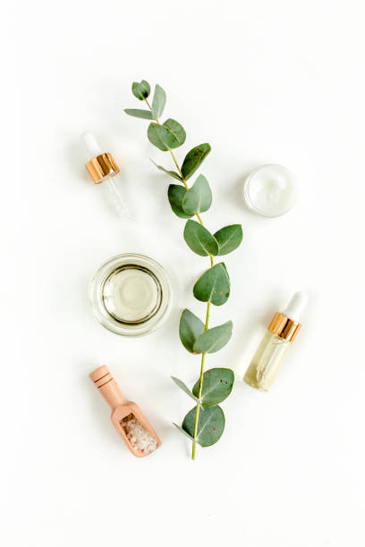 istock Eucalyptus essential oil, eucalyptus leaves on white background. Natural, Organic cosmetics products. Medicinal, Natural Serums. Flat lay, top view 1299340177