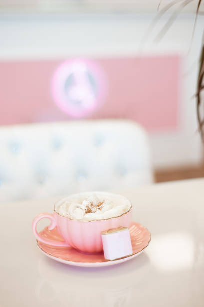 a cup of cappuccino for a client in a beauty salon - biscotti coffee cappuccino latté imagens e fotografias de stock