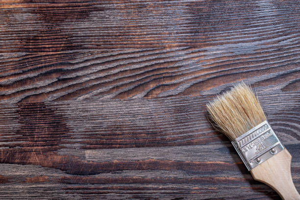 istock Paint brush on a wooden background 1299341479
