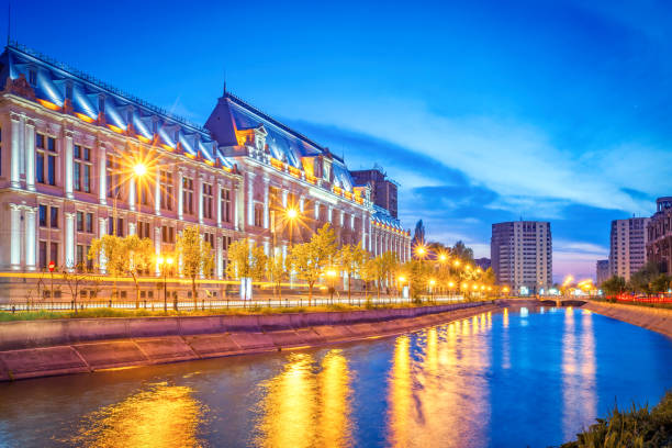 Palace of Justice and Dambovita River in downtown Bucharest Romania The Palace of Justice on the banks of the Dambovita River in Bucharest, Romania at twilight blue hour. It was built between 1890-1895 and it houses the Bucharest Court of Appeal. bucharest photos stock pictures, royalty-free photos & images
