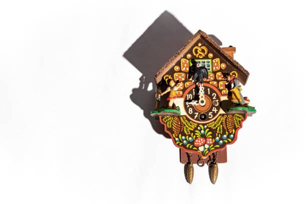 istock A colorful antique cuckoo clock with its shadow behind on a white background 1299342435