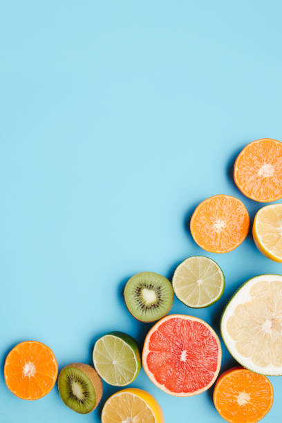 istock Summertime tropical background with exotic fruits 1299342643