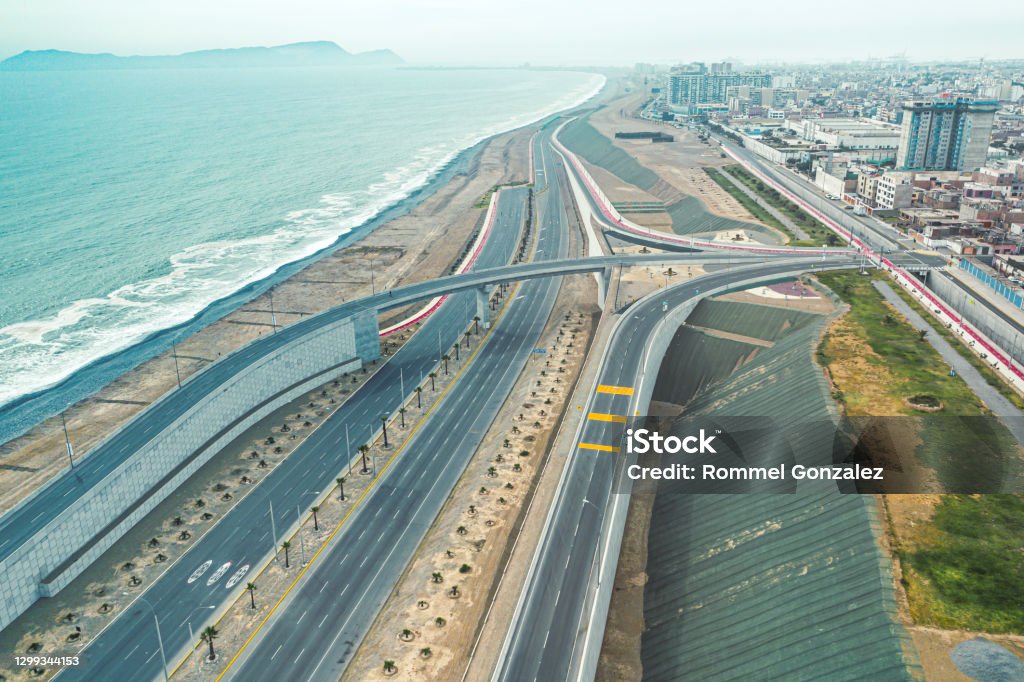 Aerial view of Lima between the clouds, view flying over the tops of the clouds and unveiling the city. Peru Stock Photo