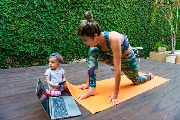 istock Fit mother exercising in her backyard 1299345822