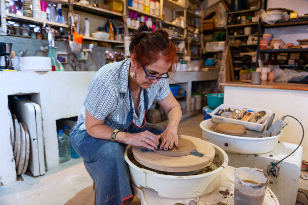 istock Senior woman in ceramics workshop 1299346347